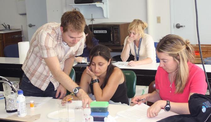 Teacher and students in class.